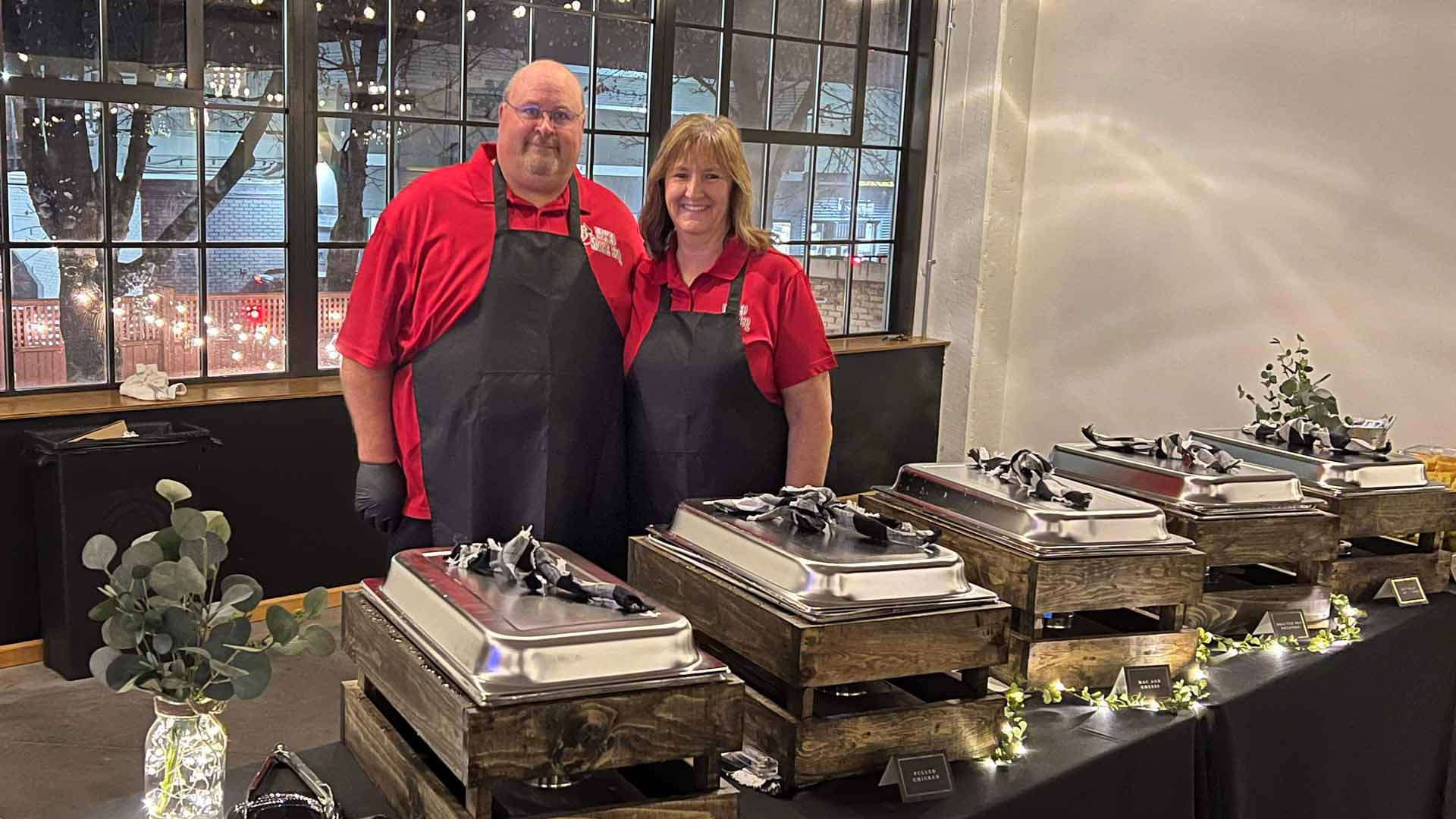 Jeff and Julie hosting an elegant catering event.